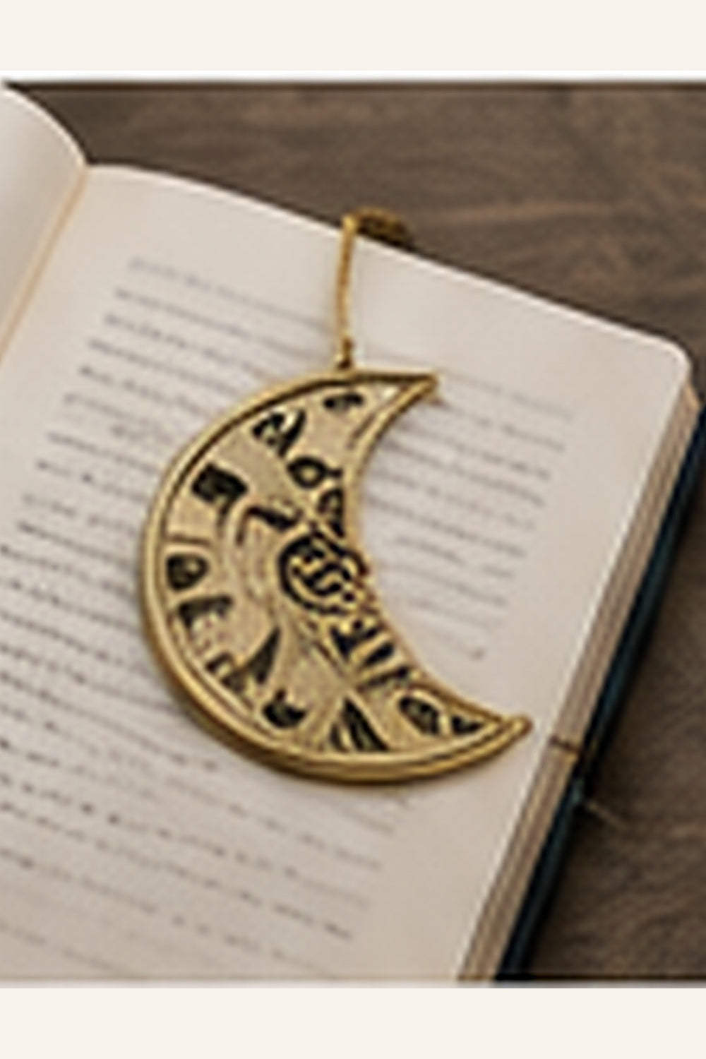 Brass moon-shaped bookmark