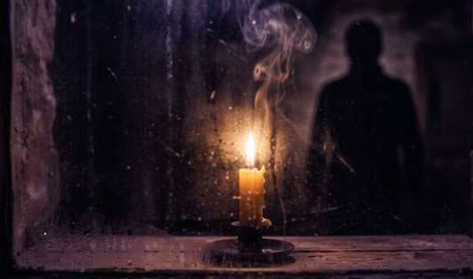 A candle behind frosted glass forming a faint figure, avoidant attachment style