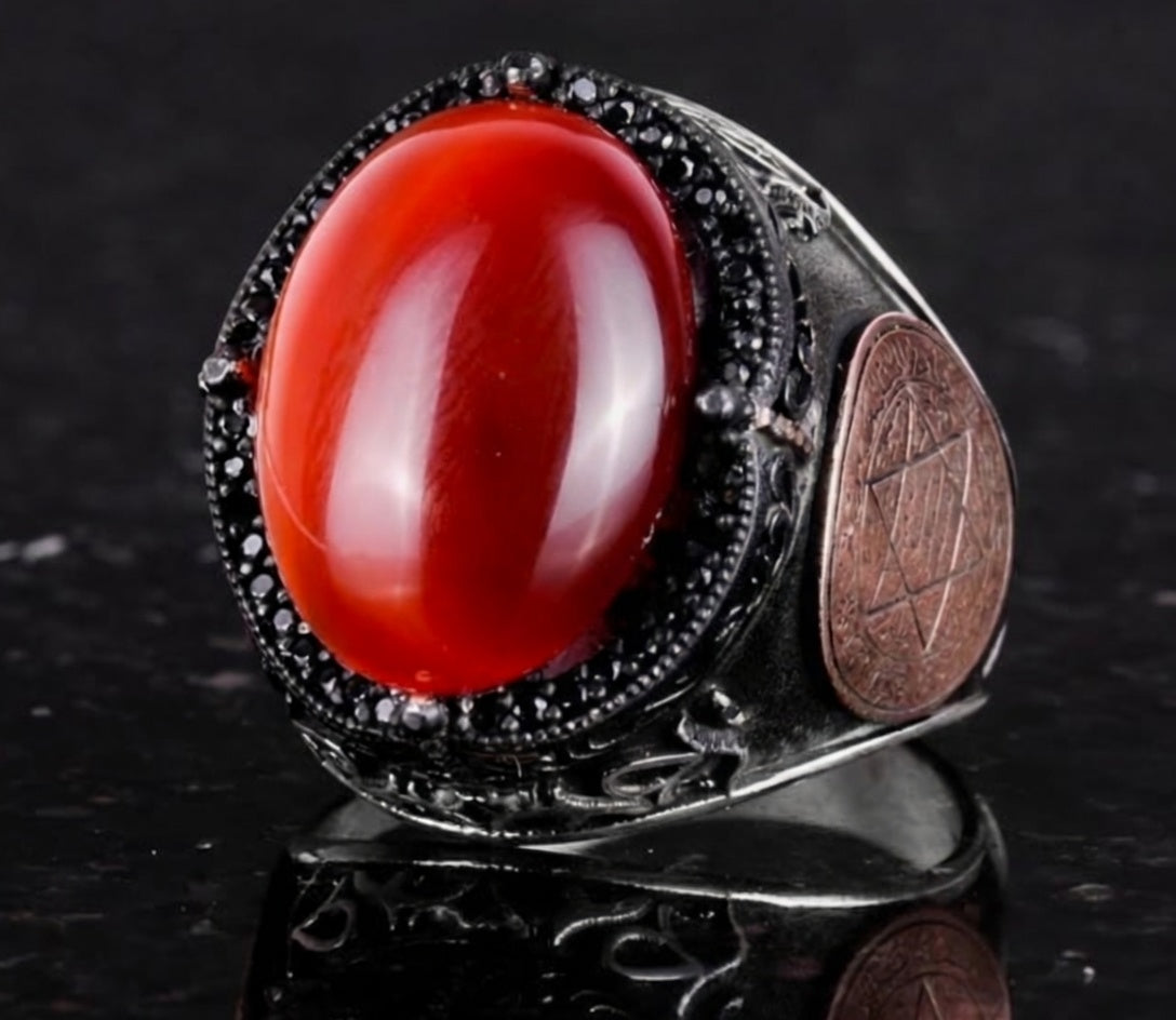 Angled view of one-of-a-kind red agate occult talisman ring
